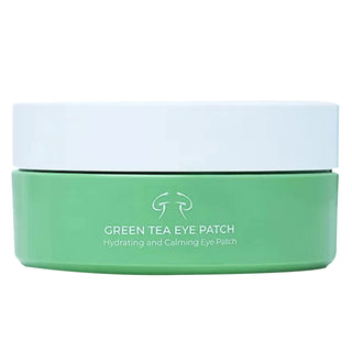 A container of my Geisha Green Tea Eye Patch cream with a white lid and a green label.