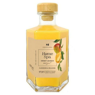 A clear glass bottle of Mango Bath Gel with a yellow liquid inside, labeled 'Home Spa' with an image of a mango and text stating it is a 'Cleansing & Relaxing' product.