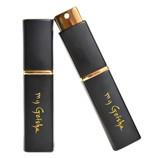 A black and gold refillable travel atomizer spray with the brand name 'my Geisha' engraved on it.