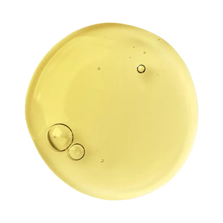 Round yellow with bubble-like structure texture sample swatch from my Geisha Sakura bath and shower gel on a white background
